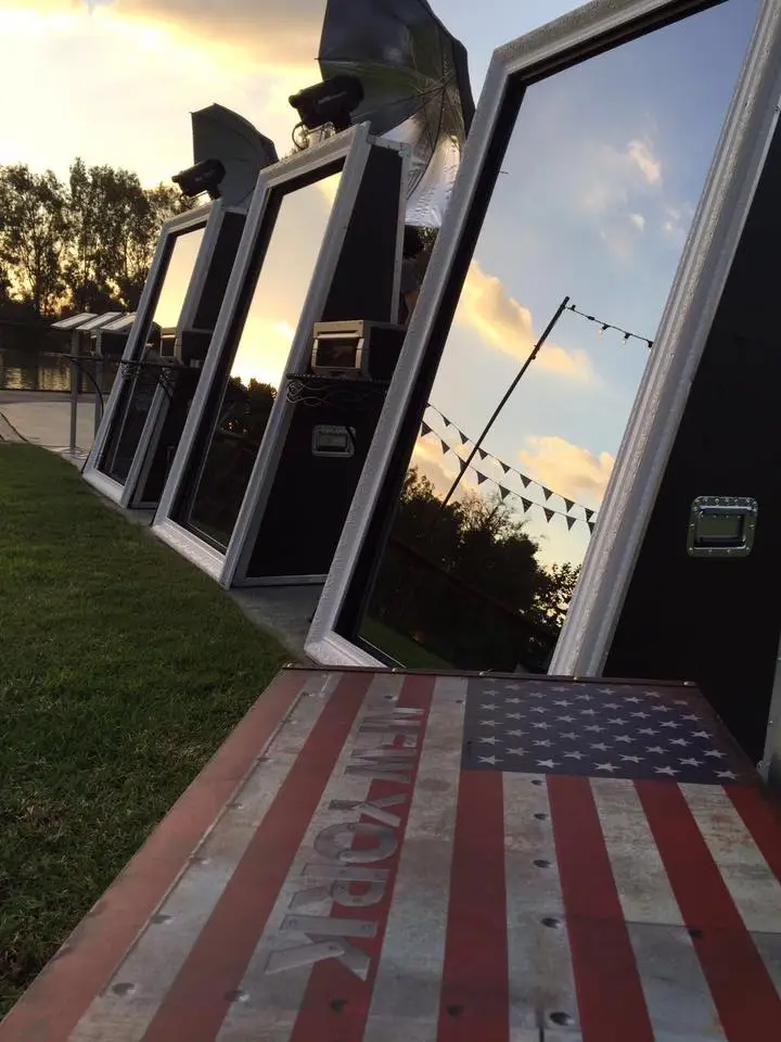 Three Parti-Panorama Photo Booth Mirrors lined up side-by-side at an outdoor corporate event